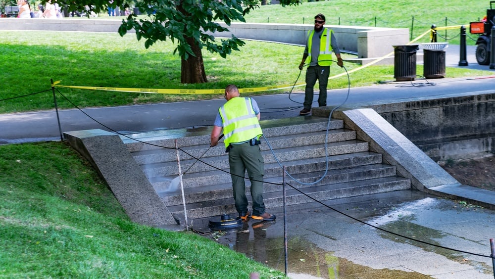 Municipal parks maintenance crew cleaning public park infrastructure