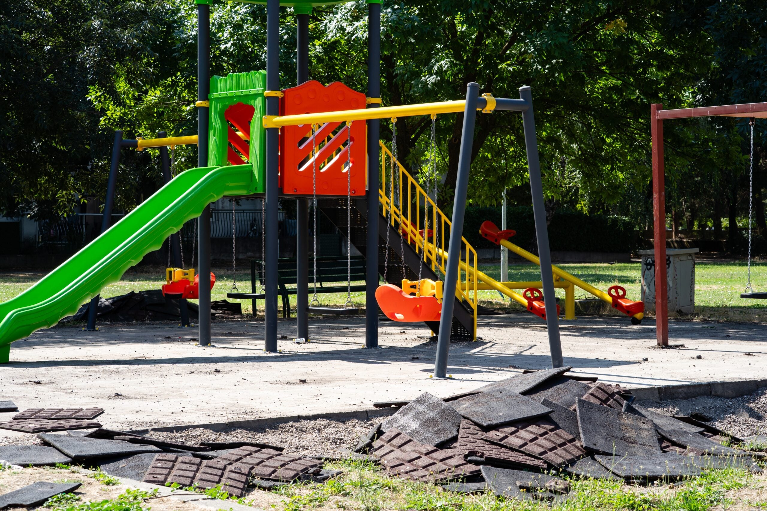 Municipal playground undergoing maintenance and surface replacement